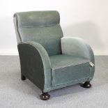 An Art Deco green upholstered armchair
