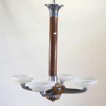 An Art Deco wooden chandelier, with frosted glass shades,