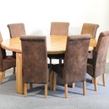 A modern light oak circular dining table, 192cm diameter,