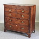 A late George III mahogany chest of drawers, on bracket feet,