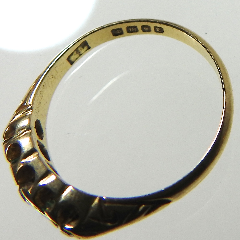 An 18 carat gold three stone diamond ring, size M, - Image 2 of 3