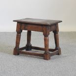 An 18th century oak joint stool,