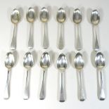 A collection of twelve 19th century silver Old English pattern dessert spoons,