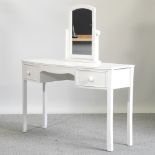 A modern Laura Ashley white painted dressing table, 120cm,