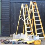 A collection of hand tools, together with two aluminium folding ladders,