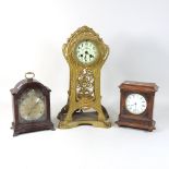 An Art Nouveau gilt spelter cased mantel clock, with a white enamel dial, 42cm high,
