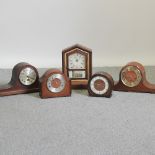 An early 20th century mantel clock, together with four others,
