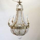 A brass and cut glass chandelier,