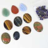 A collection of polished and cut semi-precious hardstones, to include tiger's eye,