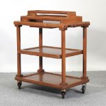 A 1920's light oak tea trolley, label S & F Martell,