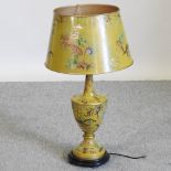 A modern toleware style yellow table lamp and shade,