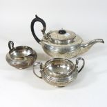 An Edwardian silver three piece tea service, London 1903,