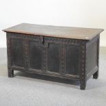 An 18th century carved oak coffer,