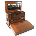 An Edwardian carved walnut table top stationery box, having a well fitted interior,