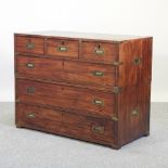 A 19th century teak and brass bound military chest, in two parts,