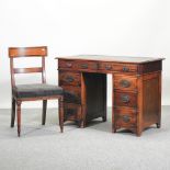 An Edwardian pedestal desk, with a black inset top, 106cm,