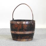 A wooden brass bound bucket,