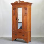 An Edwardian satin walnut single wardrobe,