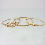 A 9 carat gold sapphire and pearl bangle,