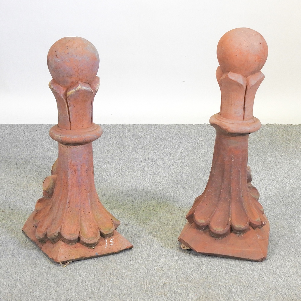 A pair of Victorian style terracotta gable end roof finials,