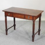 A 19th century mahogany Gillows style side table, containing two drawers, on reeded legs,