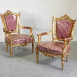 A pair of continental style gilt and red upholstered throne chairs
