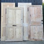 A collection of six various pine interior doors,