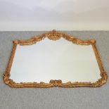 A large ornate gilt framed wall mirror,