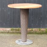 An outdoor high garden table, with a teak top,
