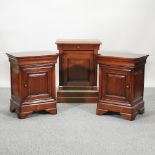 A pair of cherrywood bedside chests,