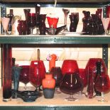 Two shelves of glassware, to include cranberry and a large creamware vase,