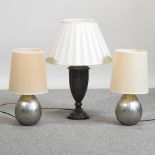 A pair of silver coloured table lamps and shades, 50cm high overall,