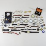 A collection of various pocket and wristwatches,