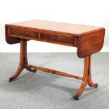 A reproduction burr yew sofa table,