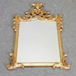 A gilt framed wall mirror, with acanthus leaf decoration,