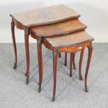 A nest of three early 20th century satinwood and polychrome painted occasional tables,