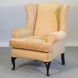 A Multiyork gold upholstered armchair