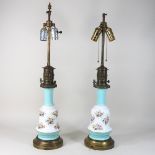 A pair of porcelain and brass mounted table lamps,