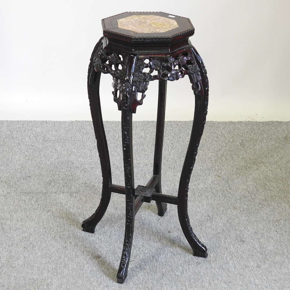 A 20th century Chinese carved hardwood marble top stand,