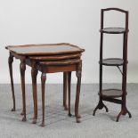A nest of three reproduction walnut occasional tables, largest 59cm,