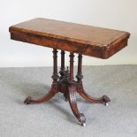 A Victorian burr walnut card table, on a quadruped pedestal base,