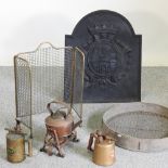 A cast iron fire back, with relief decoration, 54cm, together with a spark guard,