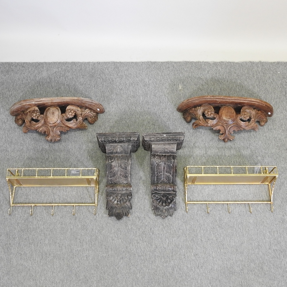 A pair of carved wooden wall shelves, 68cm,