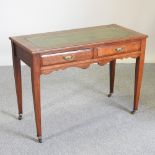 A Victorian mahogany writing table, with a green leather inset top,