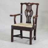 A George III Chippendale style oak open armchair,