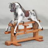 A small Haddon painted wooden rocking horse,