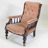 A Victorian mahogany pink upholstered button back armchair