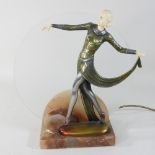 An Art Deco style figural table lamp, on a marble base, with an etched glass shade,