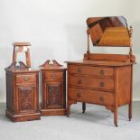 A 1920's oak dressing chest, together with a pair of Edwardian style oak bedside cabinets,