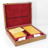 An early 20th century mahjong set, in an oak case,